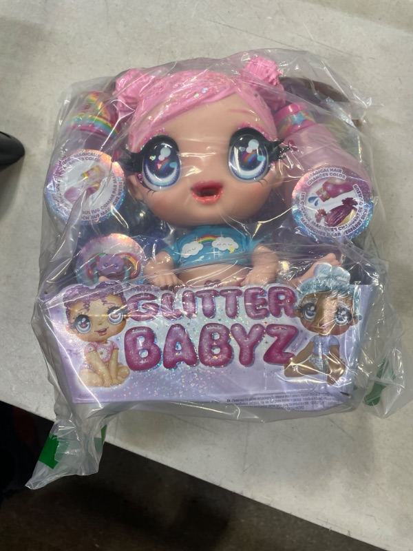 Photo 2 of MGA'S Glitter BABYZ DREAMIA Stardust Baby Doll with 3 Magical Color Changes, Pink Hair Rainbow Outfit, Diaper, Bottle, Pacifier Accessories- Gift for Kids, Toy for Girls Boys Ages 3 4 5+ Years Old