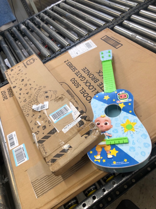 Photo 2 of CoComelon Musical Guitar by First Act, 23.5” Kids Guitar - Plays Clips of The ‘Finger Family’ Song - Musical Instruments for Kids, Toddlers, and Preschoolers