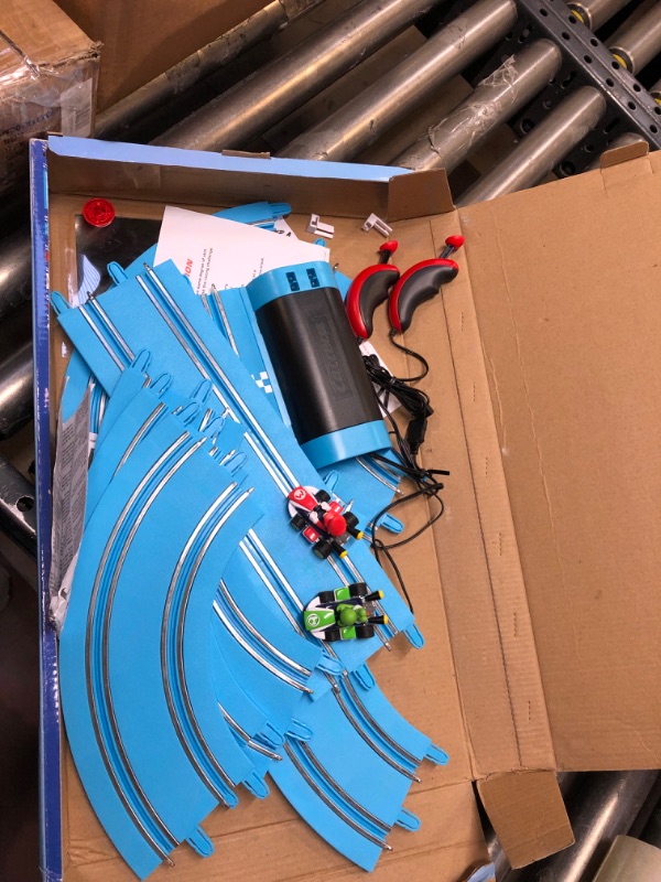 Photo 2 of Carrera First Mario Kart - Slot Car Race Track With Spinners - Includes 2 Cars: Mario and Yoshi - Battery-Powered Beginner Racing Set for Kids Ages 3 Years and Up Mario Kart w/ Spinners