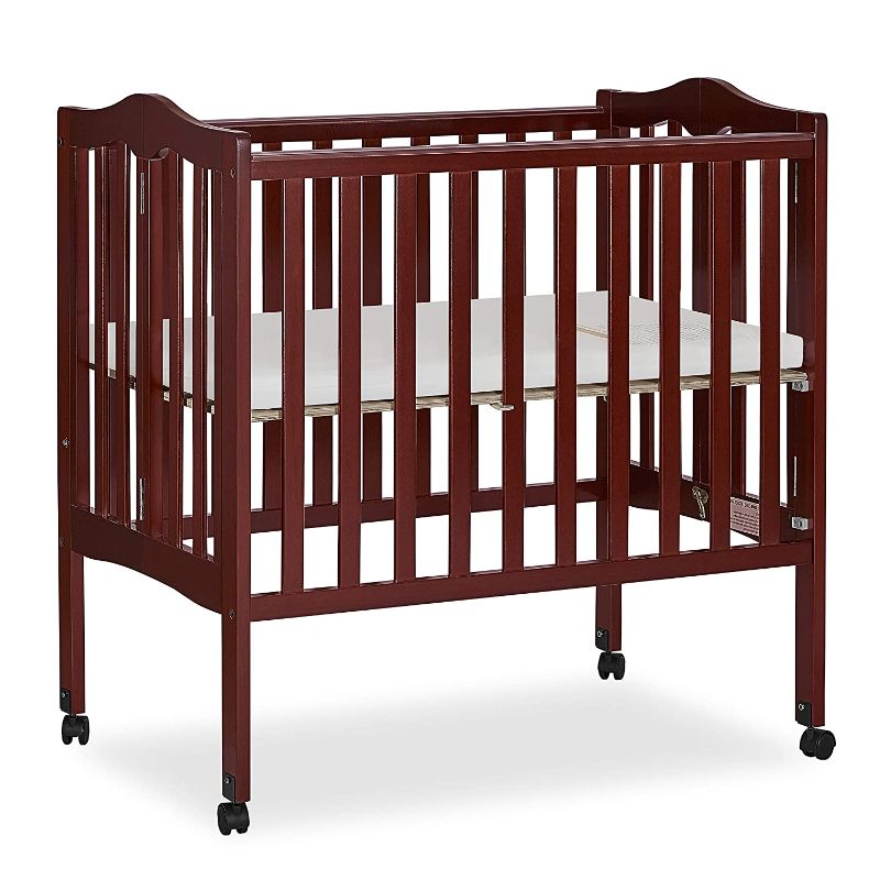 Photo 1 of Dream On Me Full Size 2-in-1 Folding Stationary Side Crib in Cherry, Locking Wheels, Folds Flat for Storage, Comes with Teething Guard, Non-Toxic Finish 40"L x 26"W x 38"H
