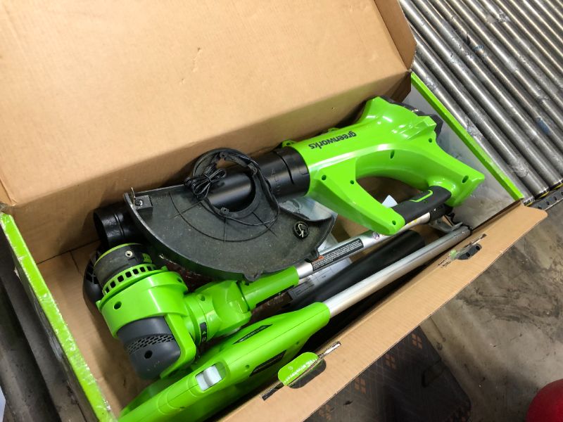 Photo 1 of GREENWORKS 24V CORDLESS STRING TRIMMER AND BLOWER COMBO