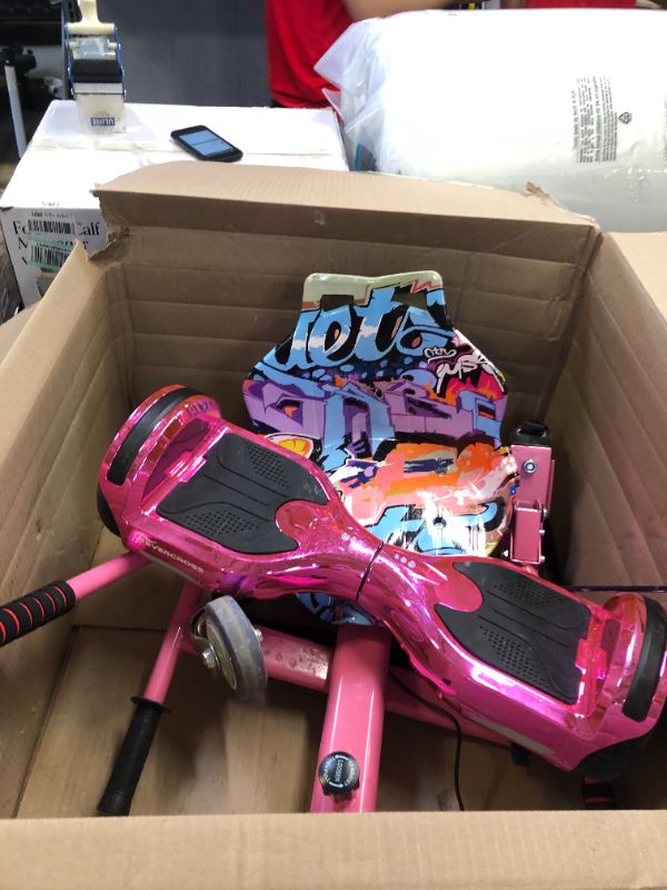 Photo 1 of girls hoverboard plus accessories (unable to test if item is functional ) 