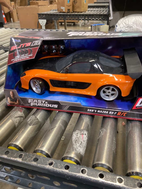 Photo 2 of Jada Toys Fast & Furious Han’s Mazda RX-7 Drift RC Car, 1: 10 Scale 2.4Ghz Remote Control Orange & Black, Ready to Run, USB Charging (Standard) (99700)