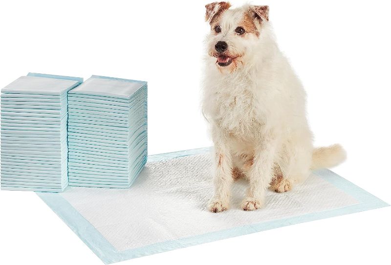Photo 1 of Amazon Basics Dog and Puppy Pee Pads with Leak-Proof Quick-Dry Design for Potty Training, Standard Absorbency, X-Large, 28 x 34 Inches, Pack of 60, Blue & White
