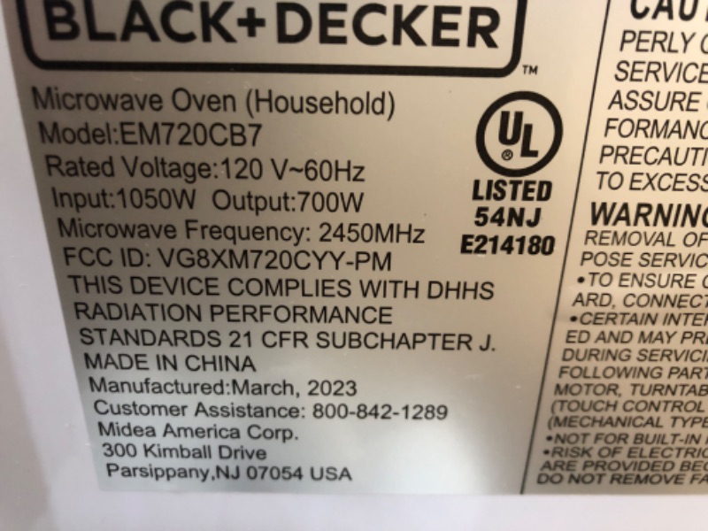 Photo 2 of **SEE NOTES**
 black+decker em720cb7 digital microwave oven with turntable push-button door,child safety lock,700w, stainless steel, 0.7 cu.ft