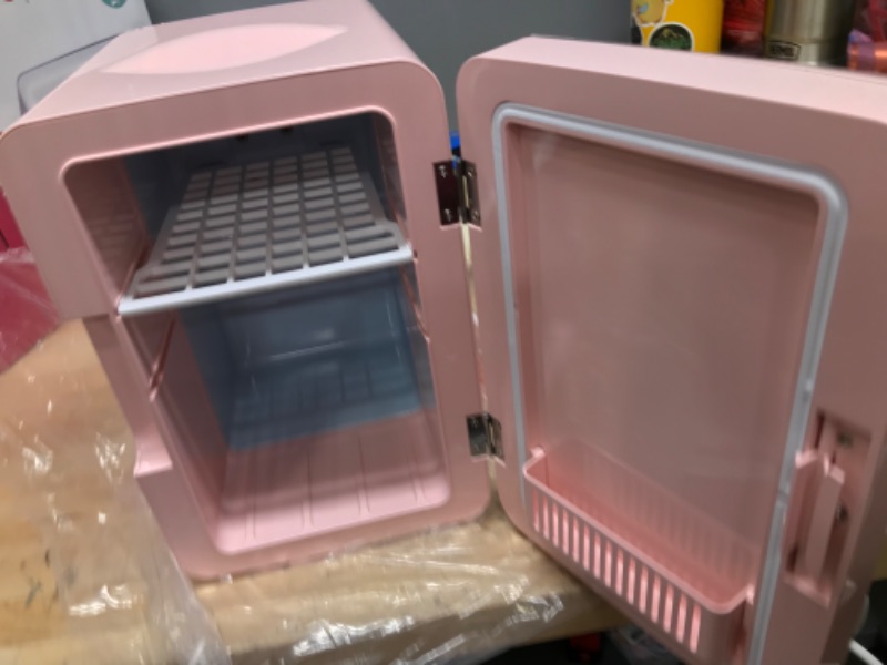 Photo 2 of **MIRROR IS DAMAGED, SEE PHOTO**
FRIGIDAIRE EFMIS170-PINK Mini Portable Compact Personal Fridge, 6.5L Capacity, 9 Cans, Makeup, Skincare, Freon-Free & Eco Friendly, Includes Home Plug & 12V Car Charger, 2022 Version, Pink