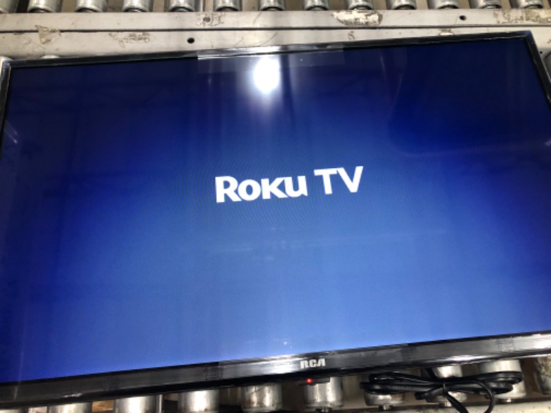 Photo 2 of RCA 32-inch Flat Screen 1080p Roku Smart LED TV - RTR3265