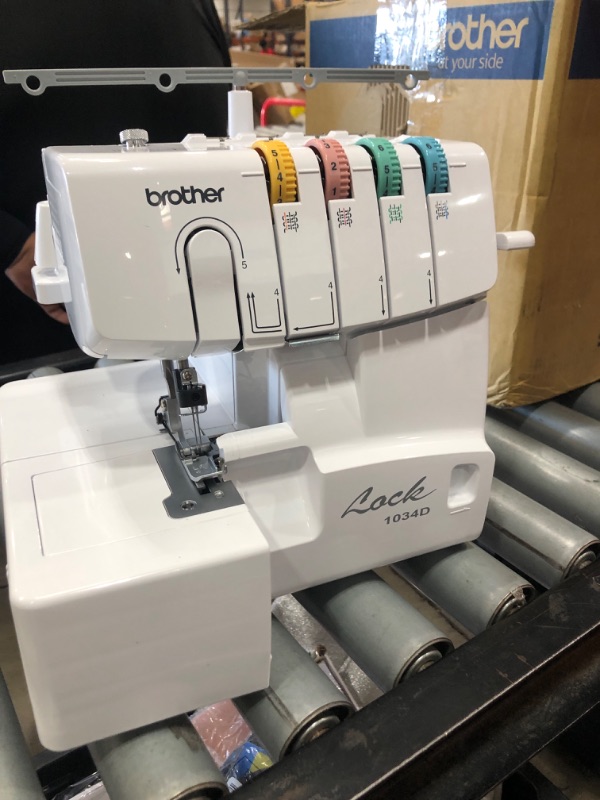 Photo 2 of *parts only* Brother Serger, 1034D, Heavy-Duty Metal Frame Overlock Machine, 1,300 Stitches Per Minute, Removeable Trim Trap, 3 Included Accessory Feet,White