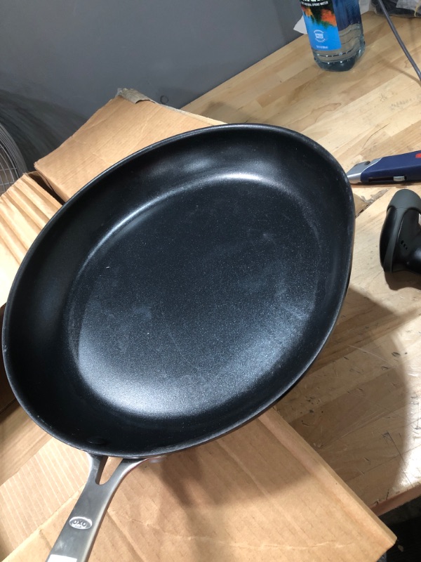 Photo 2 of ***DENTED****
OXO Good Grips Pro 12" Frying Pan Skillet, 3-Layered German Engineered Nonstick Coating, Dishwasher Safe, Oven Safe, Stainless Steel Handle, Black