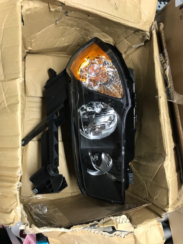 Photo 2 of TYC Left Headlight Assembly Compatible with 2004-2006 BMW X3 Driver Side