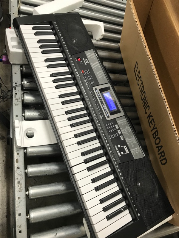 Photo 3 of **one key doesnt work** MUSTAR 61 Key Piano Keyboard, Learning Keyboard Piano with Light Up Keys, Electric Piano Keyboard for Beginners, Stand, Sustain Pedal, Headphones/Microphone, Built-in Speakers, Birthday Gifts