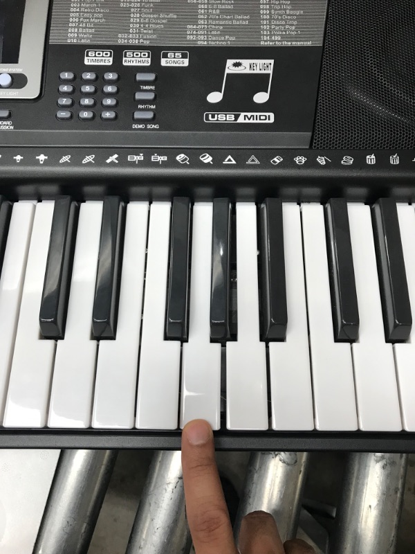 Photo 2 of **one key doesnt work** MUSTAR 61 Key Piano Keyboard, Learning Keyboard Piano with Light Up Keys, Electric Piano Keyboard for Beginners, Stand, Sustain Pedal, Headphones/Microphone, Built-in Speakers, Birthday Gifts