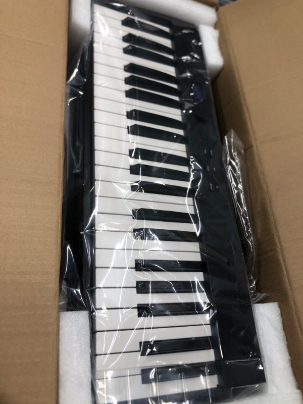 Photo 2 of KONIX Folding Piano Keyboard 88 Key Full Size Semi-Weighted Portable Keyboard Piano, Bluetooth Electric Piano with Sheet Music Stand, Sustain Pedal and Piano Bag