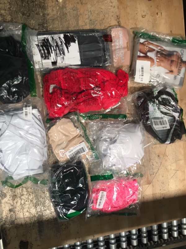 Photo 1 of 10 piece bundle of assorted clothing and various items

