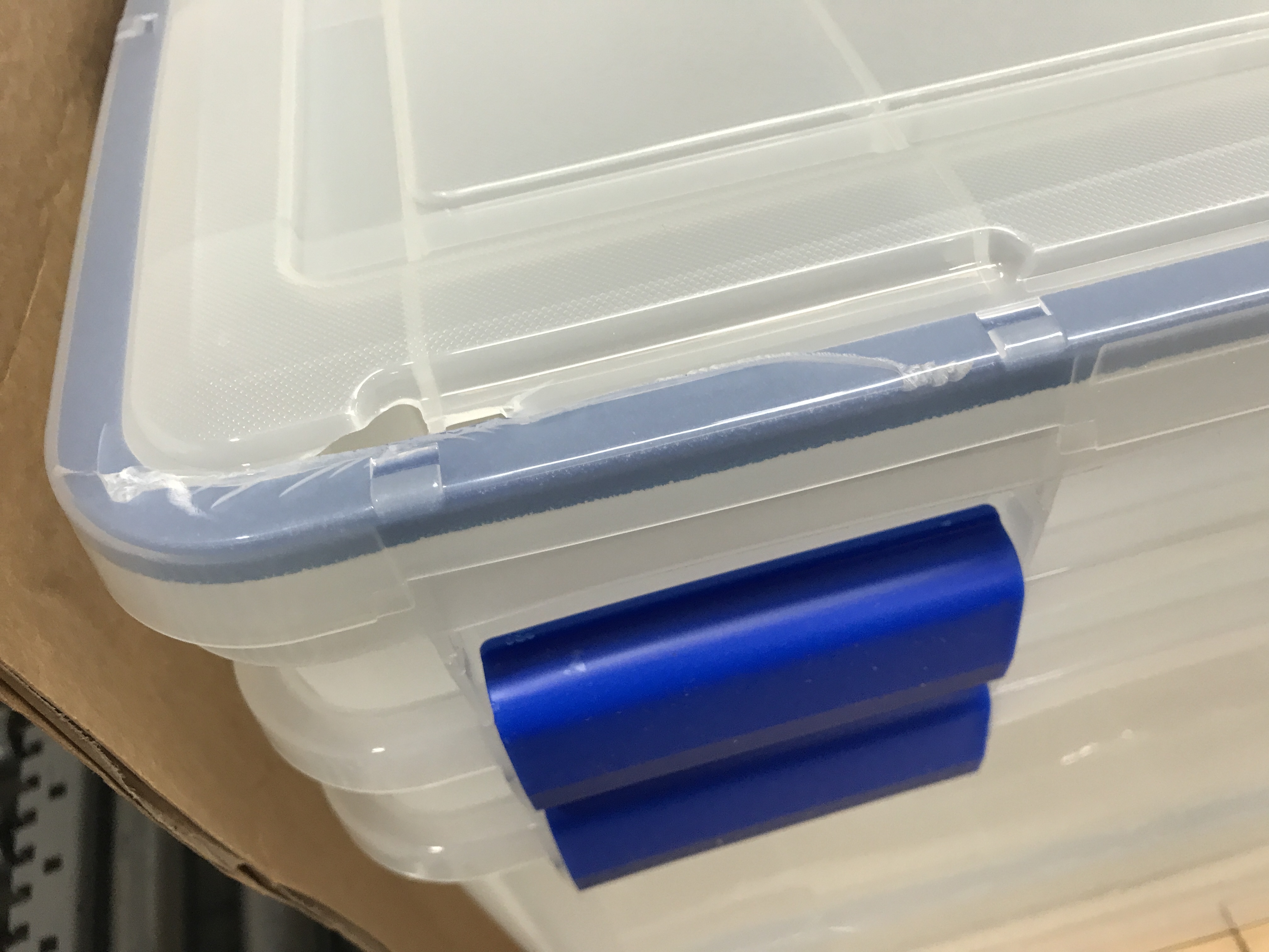 Photo 4 of **DAMAGED**
IRIS USA 70 Quart WEATHERPRO Plastic Storage Box with Durable Lid and Seal and Secure Latching Buckles, Clear With Blue Buckles, Weathertight, 3 Pack 70 Quart - 3 Pack
**MISSING LID**