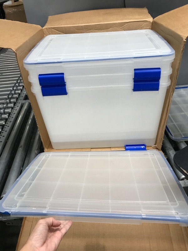 Photo 1 of **DAMAGED**
IRIS USA 70 Quart WEATHERPRO Plastic Storage Box with Durable Lid and Seal and Secure Latching Buckles, Clear With Blue Buckles, Weathertight, 3 Pack 70 Quart - 3 Pack
**MISSING LID**