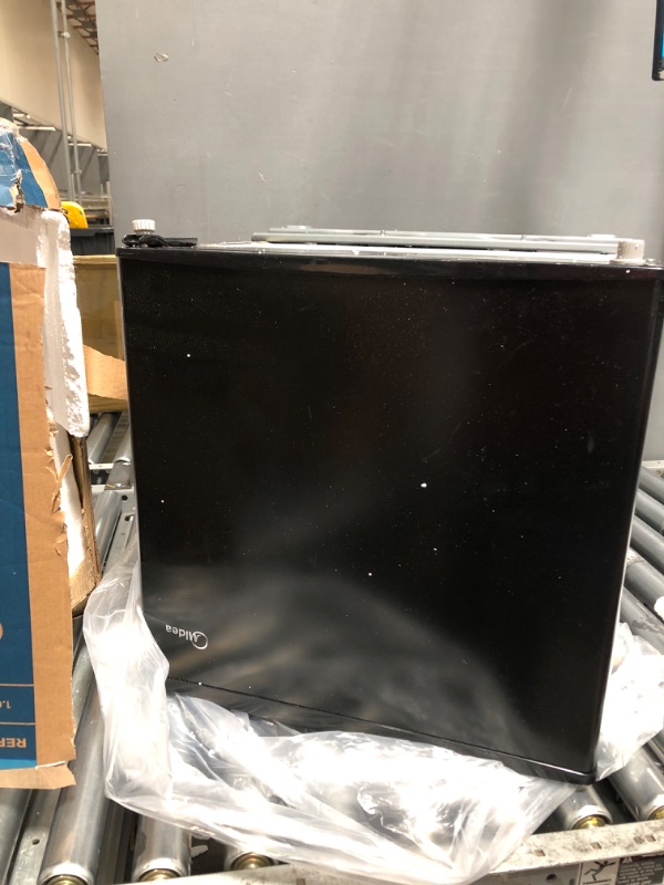Photo 2 of **FOR PARTS OR REPAIR**
Midea WHS-65LB1 Compact Single Reversible Door Refrigerator, 1.6 Cubic Feet(0.045 Cubic Meter), Black Black 1.6 Cubic Feet Refrigerator