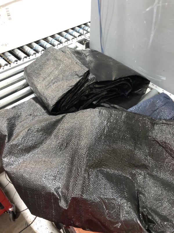 Photo 1 of **USED SIZE UNKNOWN***
Black tarp