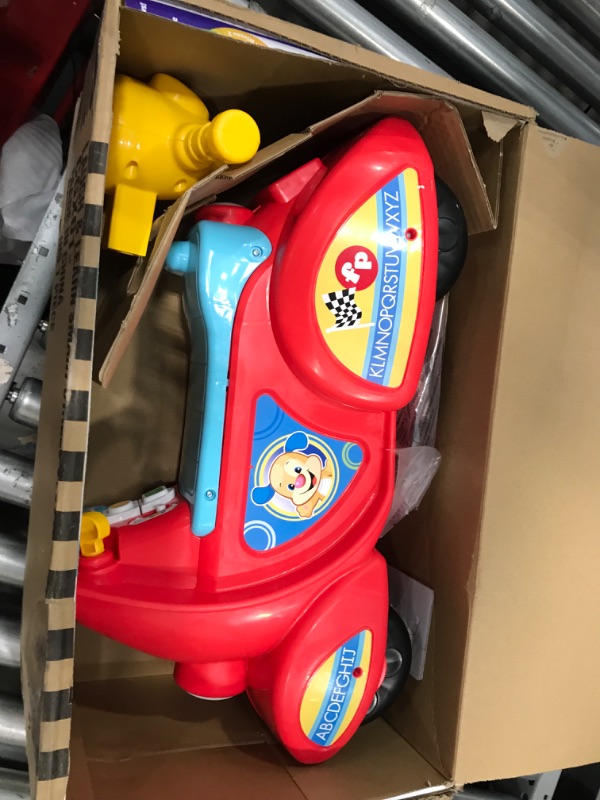 Photo 2 of Fisher-Price Laugh & Learn Smart Stages Scooter, musical ride-on toy with Smart Stages learning content for toddlers ages 1 to 3 years Standard