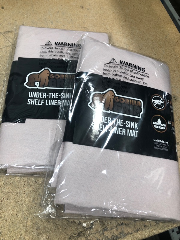 Photo 2 of **Set of 2** Gorilla Grip Quick Dry Waterproof Under Sink Mat Liner, 24x36, Slip Resistant, Non-Adhesive, Absorbent Mats for Below Sinks, Durable Shelf Liners to Protect Cabinets, Machine Washable, Pink 24" x 36" Pink