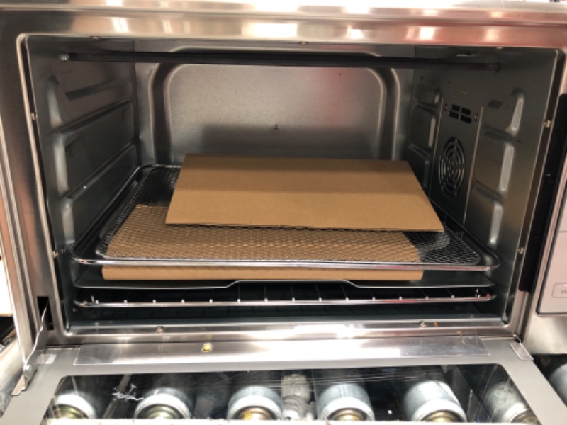 Photo 1 of *MINOR DAMAGE* Oster Air Fryer Oven, 10-in-1 Countertop Toaster Oven Air Fryer Combo, 10.5" x 13" Fits 2 Large Pizzas, Stainless Steel,Silver
