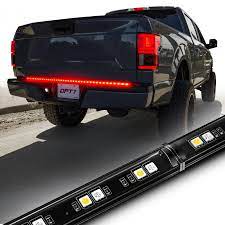 Photo 1 of **MINOR WEAR & TEAR**MICTUNING Triple Tailgate Light Bar Waterproof Plug-and-Play Aluminum Frame with 4-Way Flat Connector Wire - Amber Sequential Turn Signal, Red Brake/Running, White Reverse Lights for Pickup Truck 54 Inch Total-Tail Strip