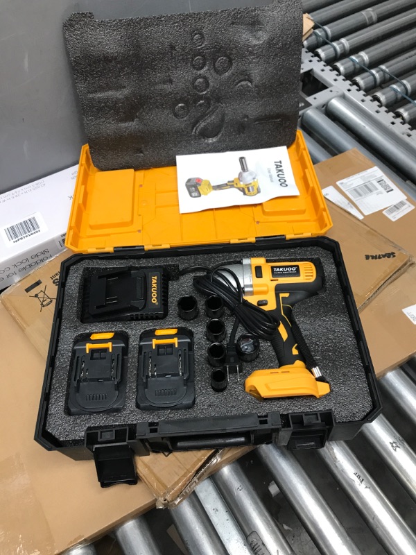 Photo 2 of Takuoo 850 N.m Cordless impact wrench,1/2 inch Brushless Impact Wrench,Max Torque (850N.m) 640Ft-lbs electric wrench with 2pcs 4000mAh Li-ion batteries.6 Sockets Power Impact Driver for Car Pipickup Orange