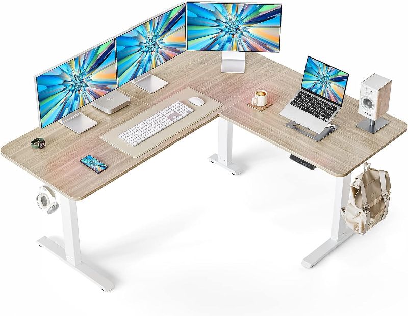 Photo 1 of FEZIBO 63" L Shaped Standing Desk Height Adjustable, Electric Stand up Corner Desk, Sit Stand Home Office Desk with Splice Board, White Frame/Light Walnut Top
