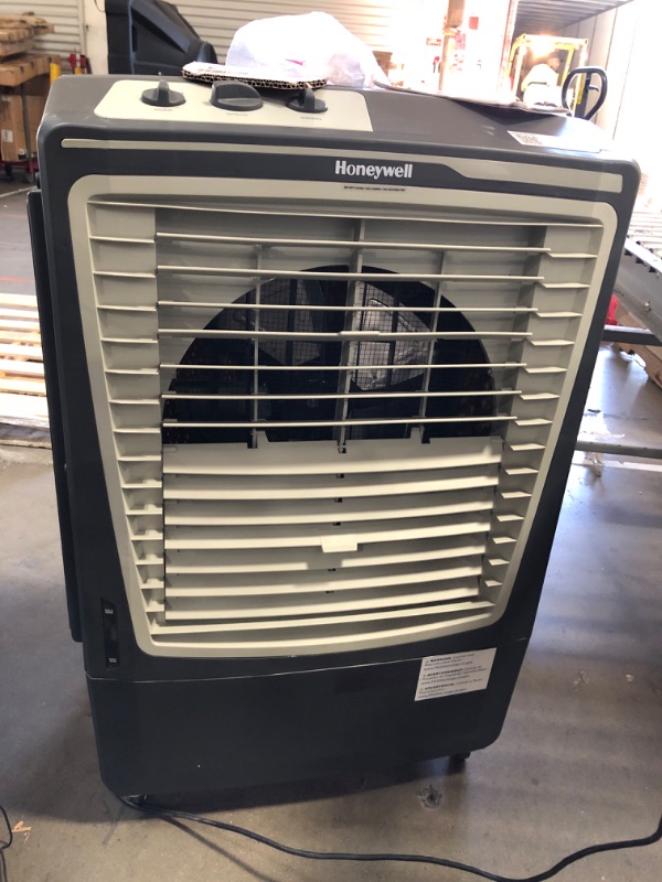 Photo 2 of **REVIEW NOTES* Honeywell 2669 CFM Outdoor Portable Evaporative Cooler & Fan, 33 Ft Air Throw for Large Outdoor Spaces, CO610PM, Black