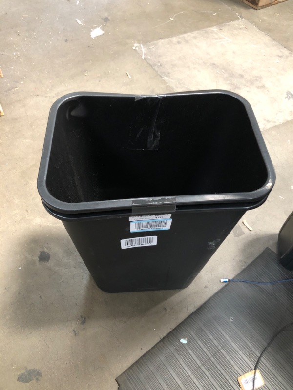 Photo 1 of 2 black garbage can