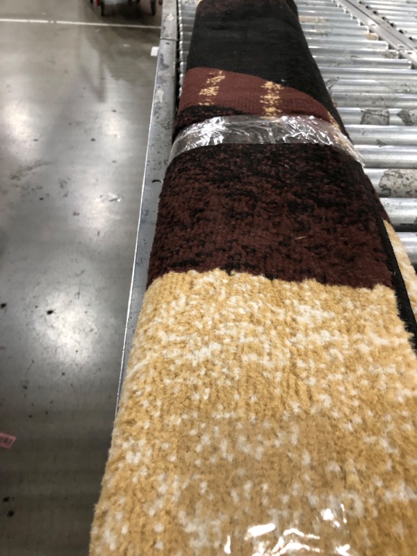 Photo 1 of 5x7 ft brown rug