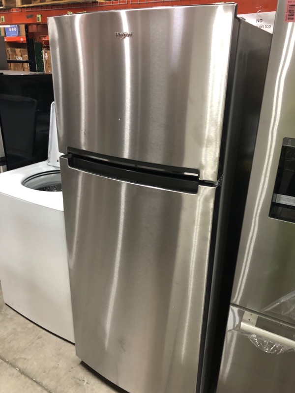 Photo 3 of  DENTED SIDE**Whirlpool 17.6-cu ft Top-Freezer Refrigerator (Monochromatic Stainless Steel)