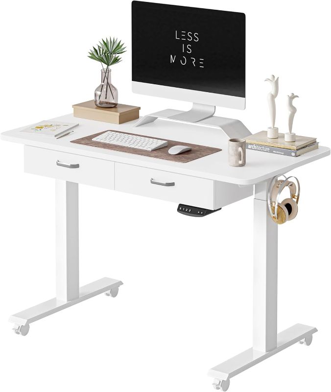 Photo 1 of FEZIBO Adjustable Height Electric Standing Desk with Double Drawer, 48 x 24 Inches Stand Up Home Office Desk with Splice Tabletop, White Frame/White Top
