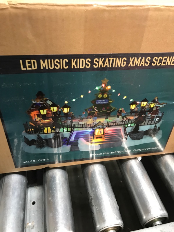 Photo 3 of *Not Exact**  Christmas Concepts® 30cm Battery Operated Musical LED Animated Ice Rink Village Scene - Plays 8 Christmas Melodies…
