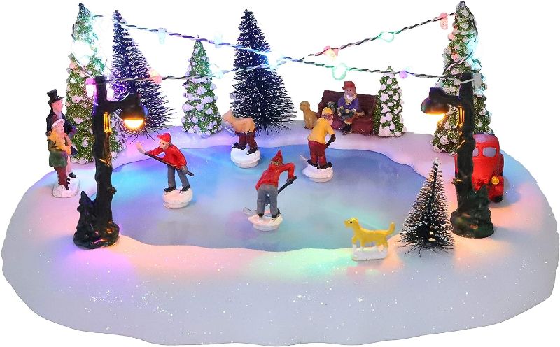 Photo 2 of *Not Exact**  Christmas Concepts® 30cm Battery Operated Musical LED Animated Ice Rink Village Scene - Plays 8 Christmas Melodies…
