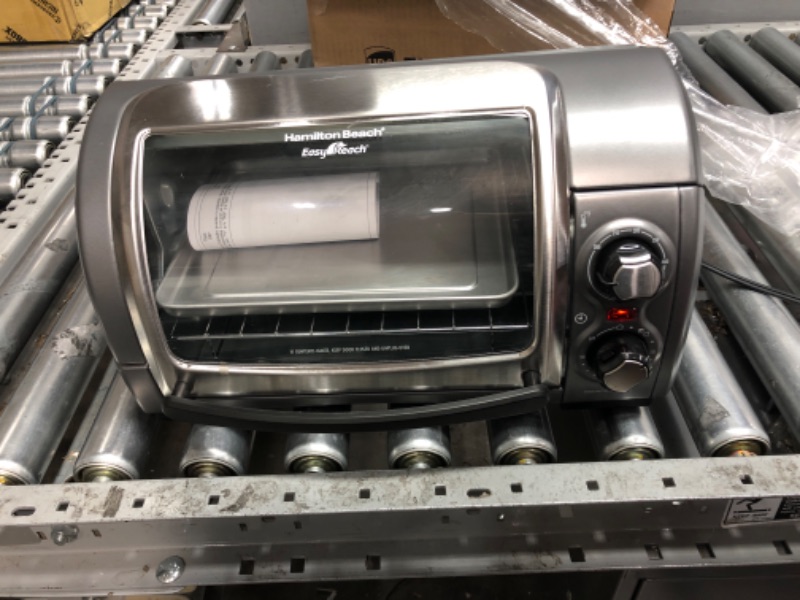 Photo 1 of ***POWERS ON - SCRATCHED AND DENTED***
Hamilton Beach Easy Reach 4-Slice Countertop Toaster Oven (31344DA)