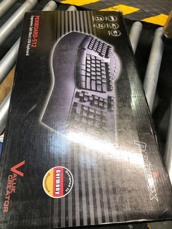 Photo 1 of Perixx Periboard-512 Ergonomic Split Keyboard - Natural Ergonomic Design - Black - Bulky Size 19.09"x9.29"x1.73", US English Layout Wired Black Keyboard