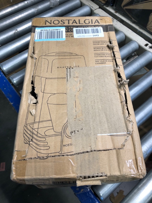 Photo 1 of Nostalgia Retro Electric Table-Top Snow Cone Maker, Vintage Shaved Ice Machine Includes 1 Reusable Plastic Cup and Ice Mold, White