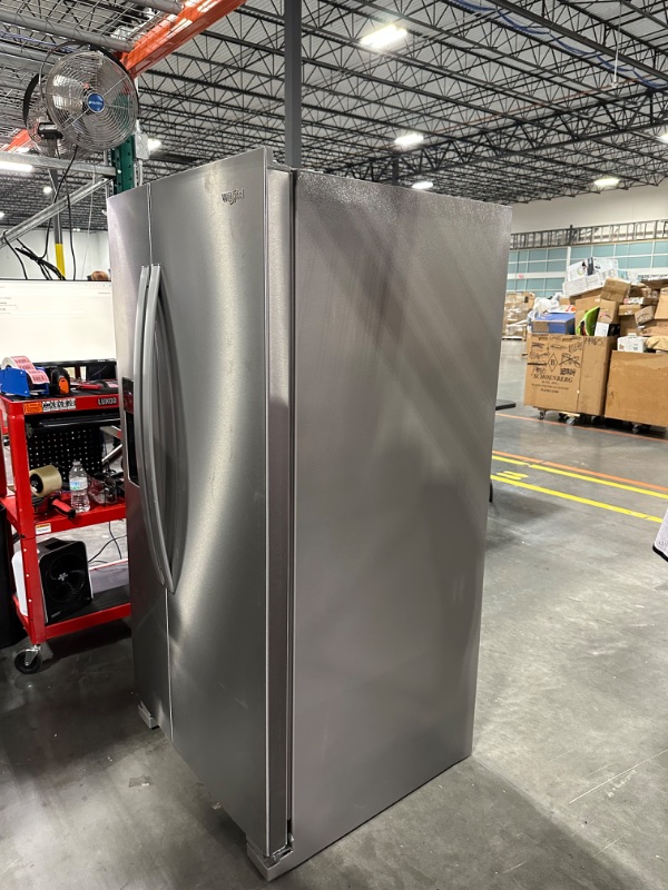 Photo 9 of Whirlpool 21.4-cu ft Side-by-Side Refrigerator with Ice Maker (Fingerprint Resistant Stainless Steel)
*per notes damage location-front* - small scruff inside fridge wall