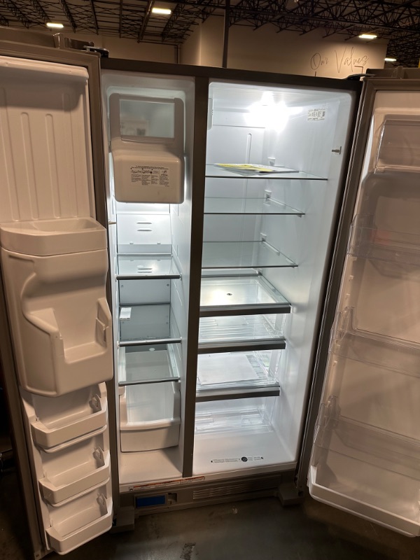 Photo 5 of Whirlpool 21.4-cu ft Side-by-Side Refrigerator with Ice Maker (Fingerprint Resistant Stainless Steel)
*per notes damage location-front* - small scruff inside fridge wall