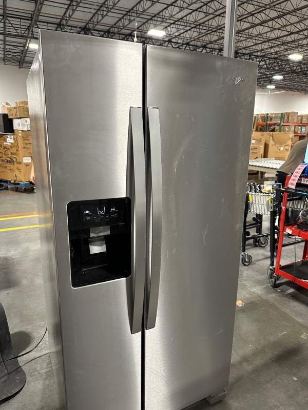 Photo 2 of Whirlpool 21.4-cu ft Side-by-Side Refrigerator with Ice Maker (Fingerprint Resistant Stainless Steel)
*per notes damage location-front* - small scruff inside fridge wall