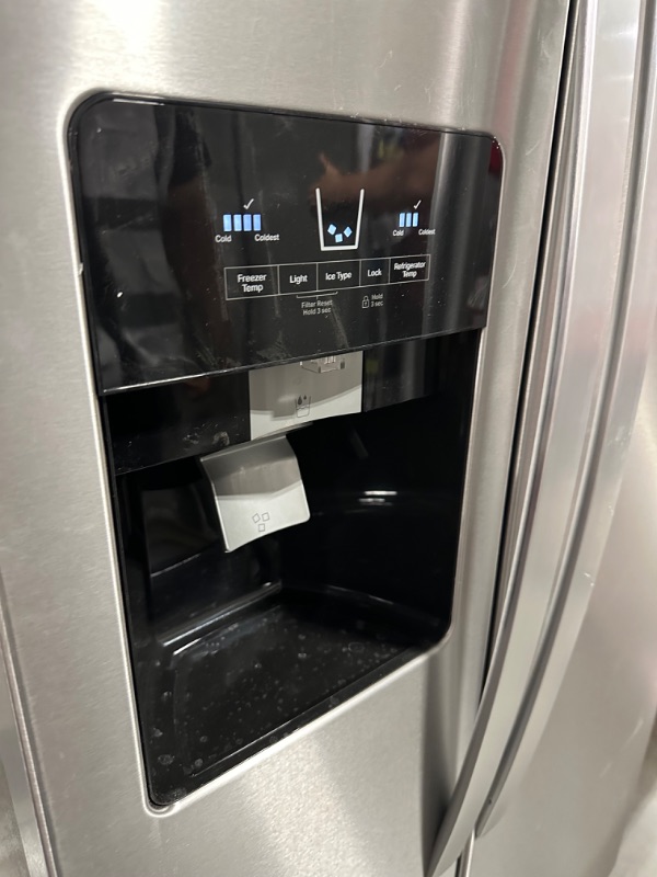 Photo 6 of Whirlpool 21.4-cu ft Side-by-Side Refrigerator with Ice Maker (Fingerprint Resistant Stainless Steel)
*per notes damage location-front* - small scruff inside fridge wall