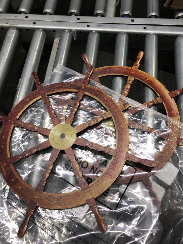 Photo 2 of 2pc ship wheel decoration 15ich
*not exact picture* 2 tips broke