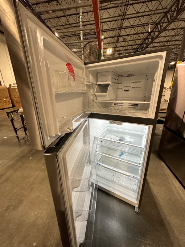 Photo 7 of Fridgedaire 30 in. 18.3 cu. ft. Top Freezer Refrigerator in Stainless Steel
*small dents infront*
