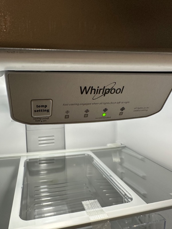 Photo 5 of Whirlpool 20.5-cu ft Top-Freezer Refrigerator (Fingerprint Resistant Stainless Steel)
*fridge handles are located inside for installation* *product is factory sealed* *small dent behind product*

*product plug is bent- view picture*
