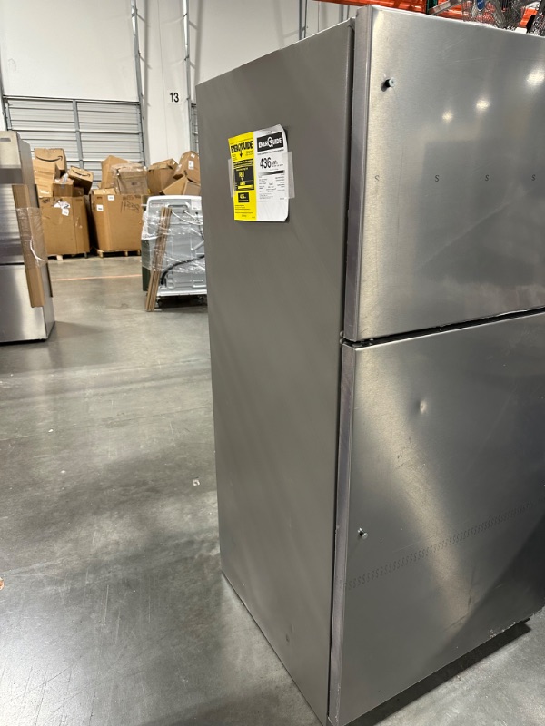 Photo 8 of Whirlpool 20.5-cu ft Top-Freezer Refrigerator (Fingerprint Resistant Stainless Steel)
*fridge handles are located inside for installation* *product is factory sealed* *small dent behind product*

*product plug is bent- view picture*
