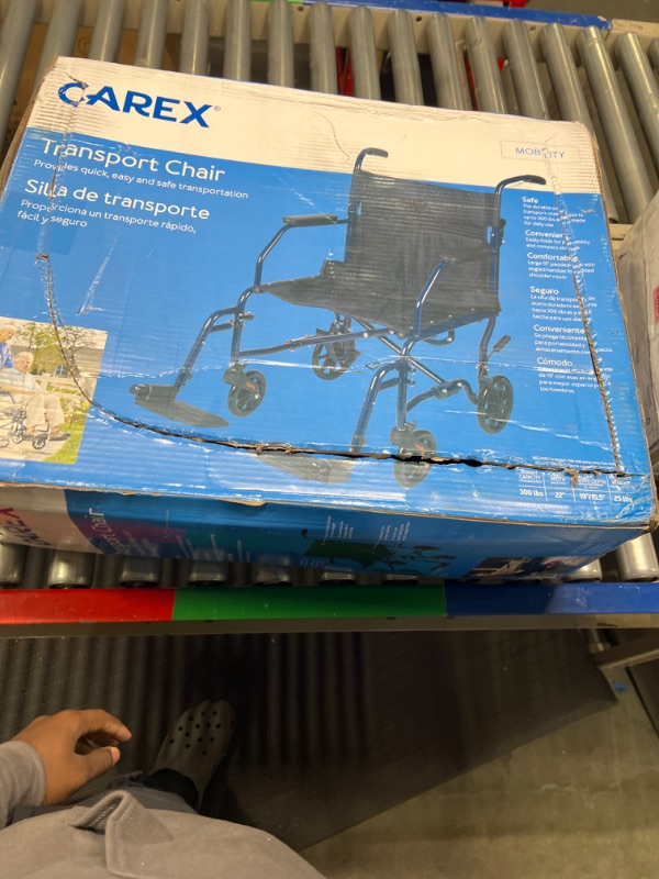 Photo 1 of Carex Transport Wheelchair With 19 inch Seat - Folding Transport Chair with Foot Rests - Foldable Wheel Chair for Travel and Storage, 1 Count
