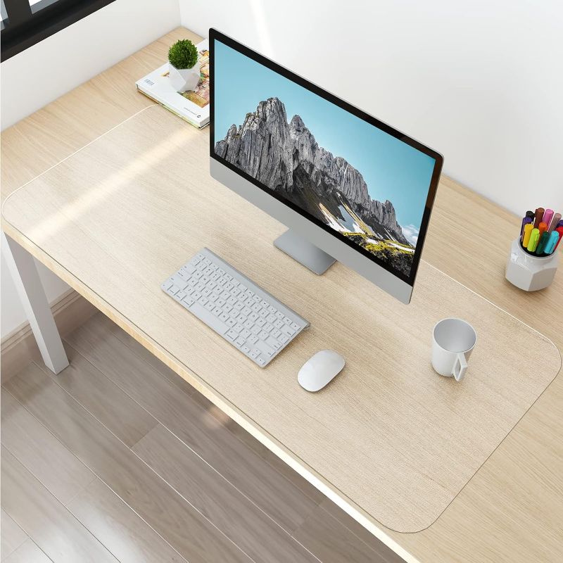 Photo 1 of NATRKE Clear Desk Mat Pad, 36"x16" Extra Large Transparent Desk Protector Mat Plastic Desk Mat, 1.5mm PVC Translucent Waterproof Non-Slip Clear Writing Desk Pad Blotter for Desktop for Home Office
