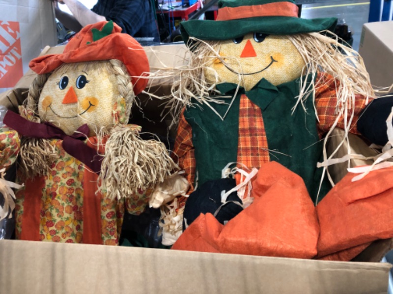 Photo 1 of 60 in. Sitting Scarecrow Couple (Set of 2)
