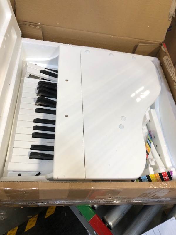 Photo 3 of Hape Deluxe White Grand Piano | Thirty Key Piano Toy with Stool, Electronic Keyboard Musical Toy Set for Kids 3 Years+
***Small scratches/scuffs***
